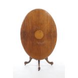 A Victorian walnut oval loo table The quarter veneered oval top centred with a circular inlaid