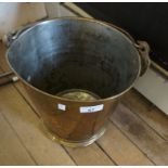 An unusual brass coal bucket, the side joints with intials SWJ with swastika.