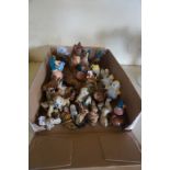 A mixed lot of assorted ceramic animals to include Wade Whimsies, Beswick, etc.