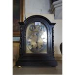 A 1920/30s dark oak bracket clock.