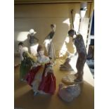 Three Lladro figurines to include a table lamp and Nao model of two ducks, two dolphins figurines,