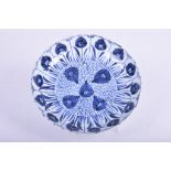 A Chinese porcelain blue and white 'Aster' dish, Kangxi period (1662 - 1722) Of circular form,