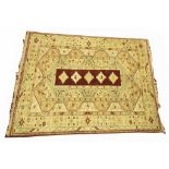 A Persian Heriz style carpet Of rectangular form with tasselled edging,