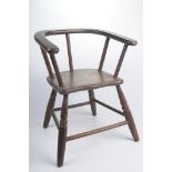 A Child's wooden Windsor type armchair The four turned and splayed supports,