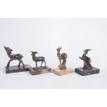 A Collection of Art Deco deer figures Each of the cast metal figures in varying poses,