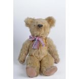 A 1960's Joint Teddy Bear The plush Teddy with embroidered snout and pad paws and pads,