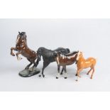 A Collection of Beswick horse figures To include a rearing bay horse with 1014,