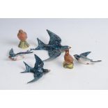 A collection of Beswick Ceramics To include a graduated set of four swallow wall plaques,