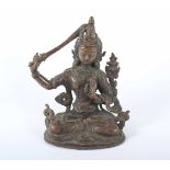 BODHISATTVA MANJUSRI, stark kupferhaltige Bronze, in der erhobenen Rechten das Schwert der