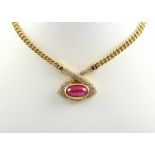 COLLIER, 750/ooo Gelbgold, Brillanten von zusammen ca.3,4 ct., Rubincabochon von ca. 19,0 ct.,