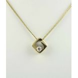 ANHÄNGER AN KETTE, 585/ooo Gelbgold, besetzt mit einem Brillantsolitär von ca. 0,30 ct., L der Kette