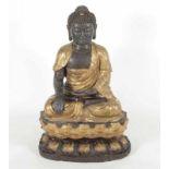 BUDDHA SHAKYAMUNI, Bronze, braun patiniert und partiell vergoldet, über einem doppelten Lotos