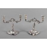 JUGENDSTIL-LEUCHTERPAAR, Zinn, versilbert, zweiflammig, H 20, um 1900 22.00 % buyer's premium on the