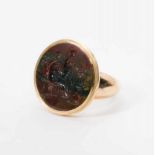 An antique 18 carat gold ring with jasper Late 19th century The gold ring set with a circular