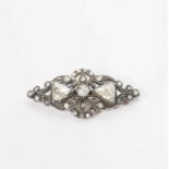 A 14 carat gold and silver brooch with diamonds The Netherlands, first half 20th century The oval-