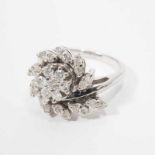 A 14 carat white gold ring with diamonds Circa 1970 The white gold ring formed as a stylised floral