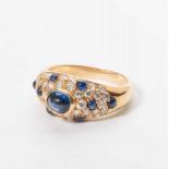 An 18 carat gold Cartier ring with diamonds and sapphires Paris, circa 1980 The gold ring set with