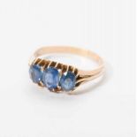 An antique 14 carat gold ring with sapphires Late 19th century The gold ring set with a row of