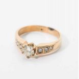 An antique 14 carat gold ring with diamonds Late 19th century The gold ring set with central old-