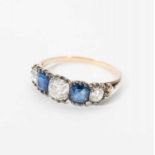 An antique 14 carat gold ring with diamonds and sapphires Late 19th century The gold ring set with