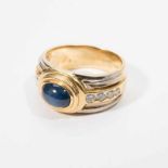 An 18 carat bi-colour gold ring with diamonds and sapphire Circa 1980 The wide white and yellow