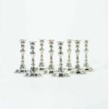 Eight silver Louis XV-style candlesticks All marked with Dutch rampant lion, three with date mark