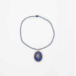 An antique 14 carat gold pendant medallion with diamonds, lapis lazuli and pearls Circa 1900 The