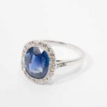 A platinum Art Deco ring with diamonds and sapphire Circa 1925 The platinum ring with central oval