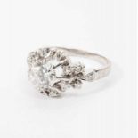 A platinum Retro ring with diamonds Circa 1960 The white gold ring set with a central brilliant-cut