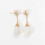 A pair of antique 14 carat gold ear studs with opal Circa 1900 The ear set with an oval milk opal,