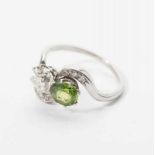 A platinum Belle Époque ring with diamonds and demantoid Circa 1915 The platinum ring set with a
