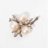 An antique 18 carat gold and silver brooch with diamonds and natural pearls Early 20th century The