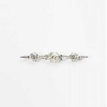 An 18 carat white gold bar brooch with diamonds 20th century The white gold brooch set with three