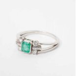 An 18 carat white gold ring with diamond and emerald The Netherlands, circa 1960 The white gold