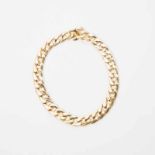 An 18 carat gold necklace Circa 1980 The gold necklace formed of flat gourmette links, marked with