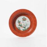 A Chinese famille rose and faux bois dish 20th century The interior decorated with a roundel with