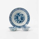 A Chinese blue and white dish and two blue and white 'kraak porselein' bowls 17th century and Wanli