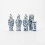 A set of three Chinese blue and white vases and covers and a rouleau vase 19th-20th century