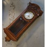 A Gustav Becker walnut cased chiming wall clock, the circular enamel dial set with Arabic numerals,