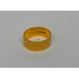 A 22ct yellow gold band, size I 1/2, approx 5.7g.