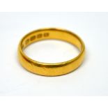 A 22ct yellow gold wedding band, size P 1/2, approx 5.9g.