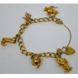 A 9ct yellow gold charm bracelet set with various gold charms, approx 22.2g.