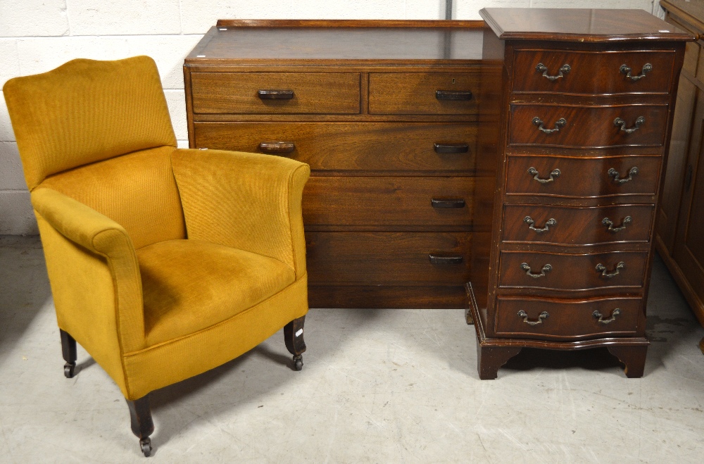 A reproduction mahogany six-drawer bow-front chest, an oak two-over-three chest of drawers,