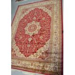 A red ground Keshan carpet, 280 x 200cm.