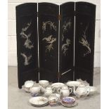 A 20th century Oriental ebonised four-panel folding screen,