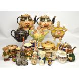 A quantity of decorative ceramics and teaware to include Derby style teapots, toby jugs,