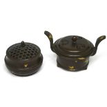 Two small Oriental bronze lidded pots, each with character marks to base,