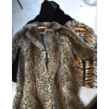 Three faux fur coats to include a dark brown full-length example,