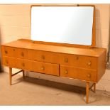 A retro six-drawer mirror back sideboard on tapering legs, width 168cm.