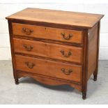A 20th century pine three-drawer chest of drawers with brass handles, width 92cm.